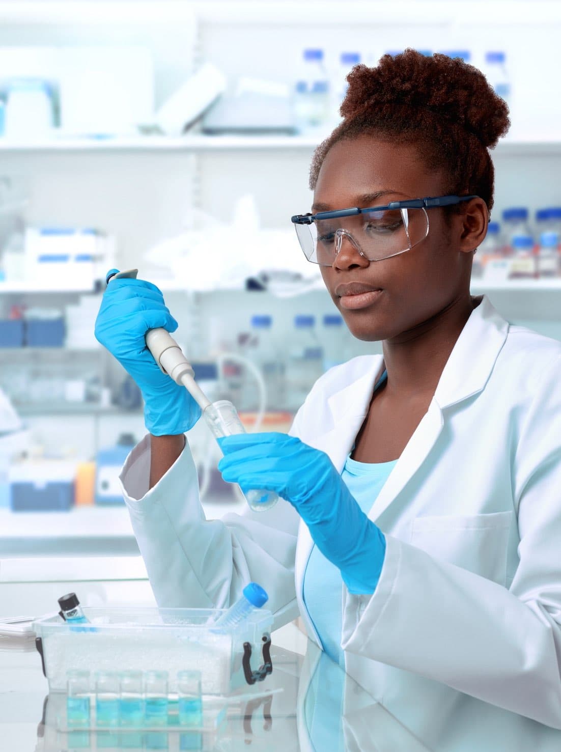 Laboratory worker using microscope