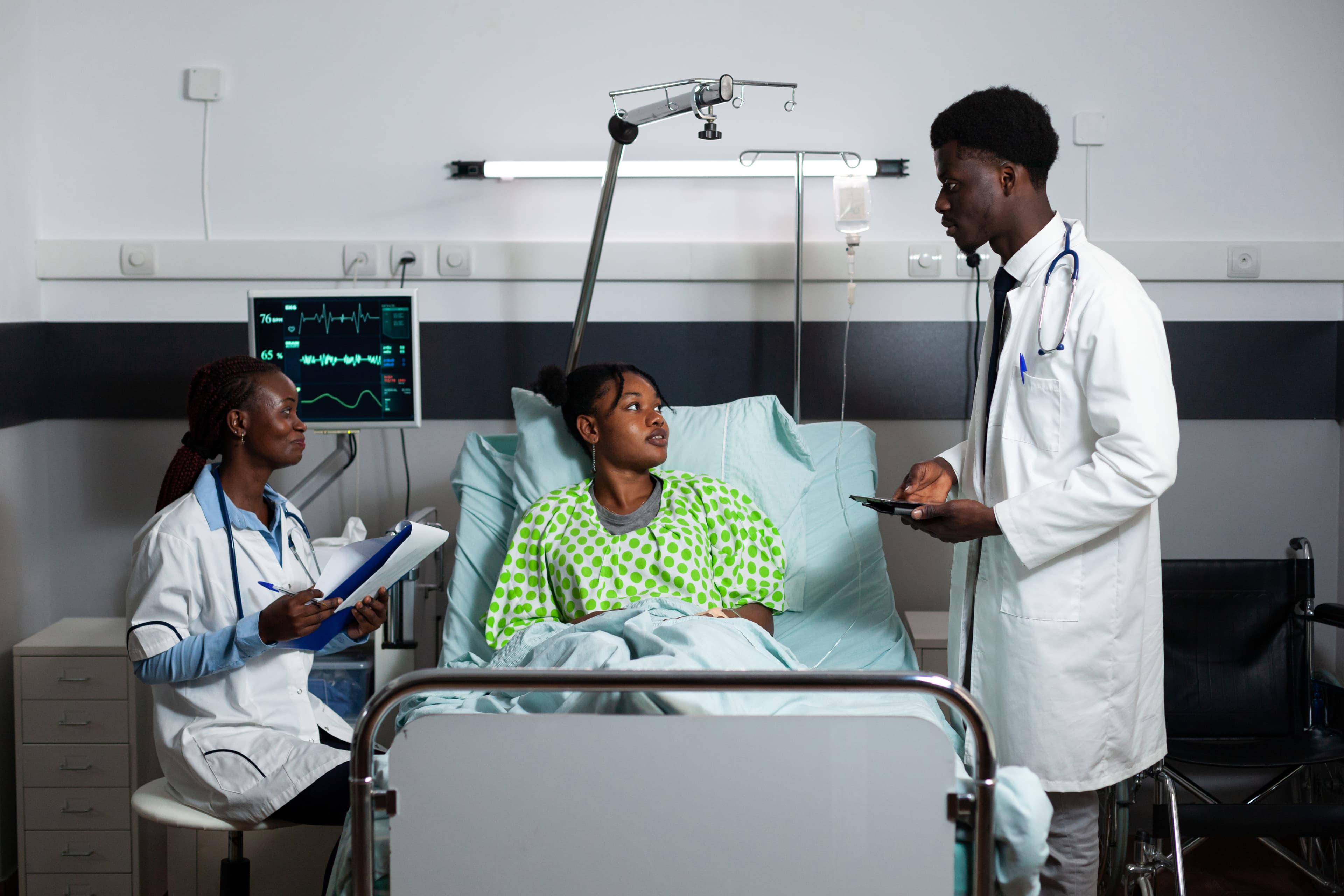 Doctors consulting with patient